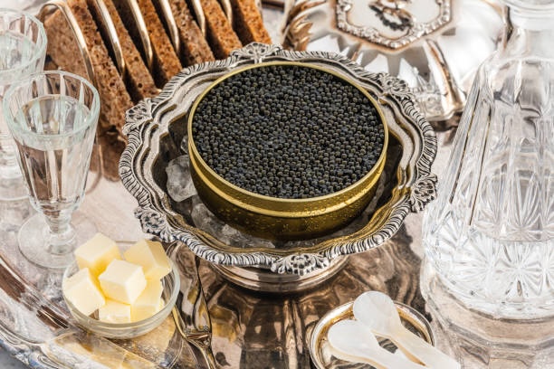 Caviar served in tin over ice with cheese and bread